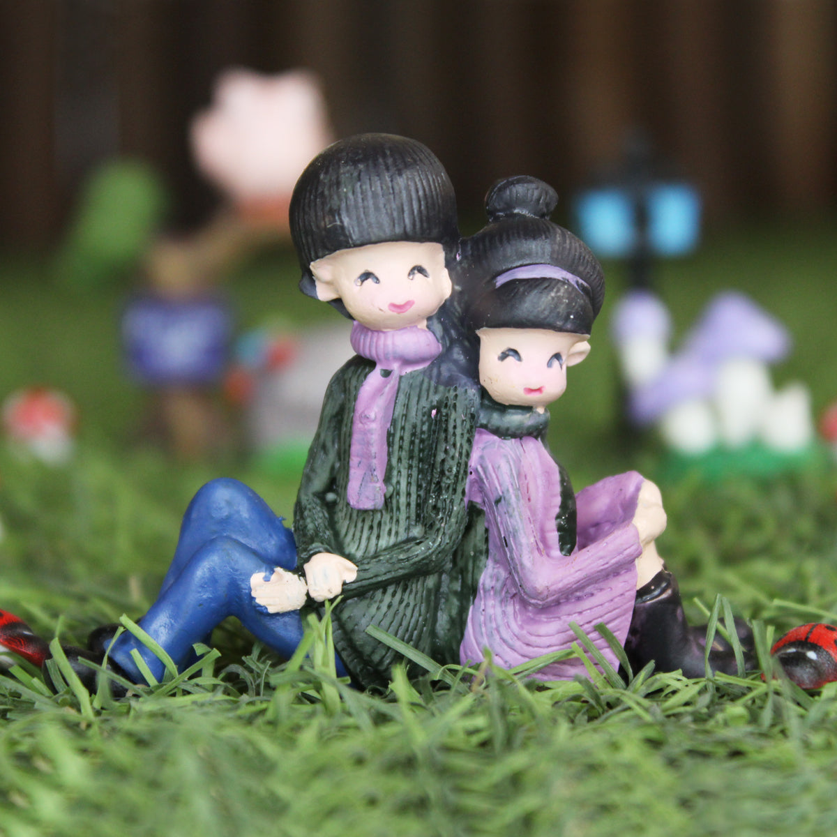 Couple Sitting Back to Back Miniature