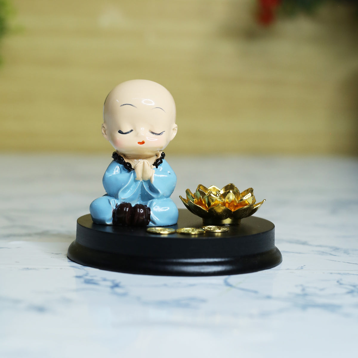 Monk with namaste incense stick stand