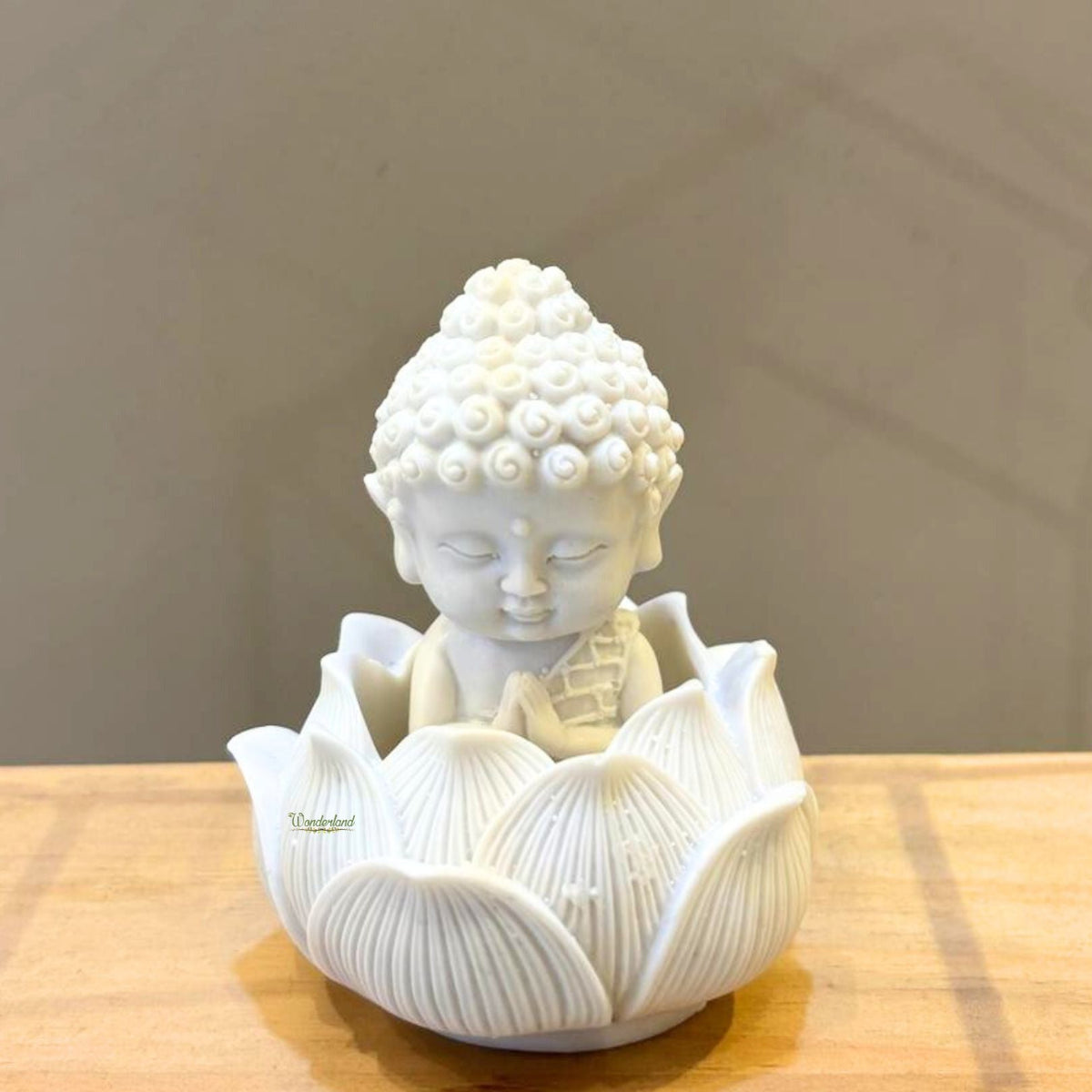 White resin monk on lotus