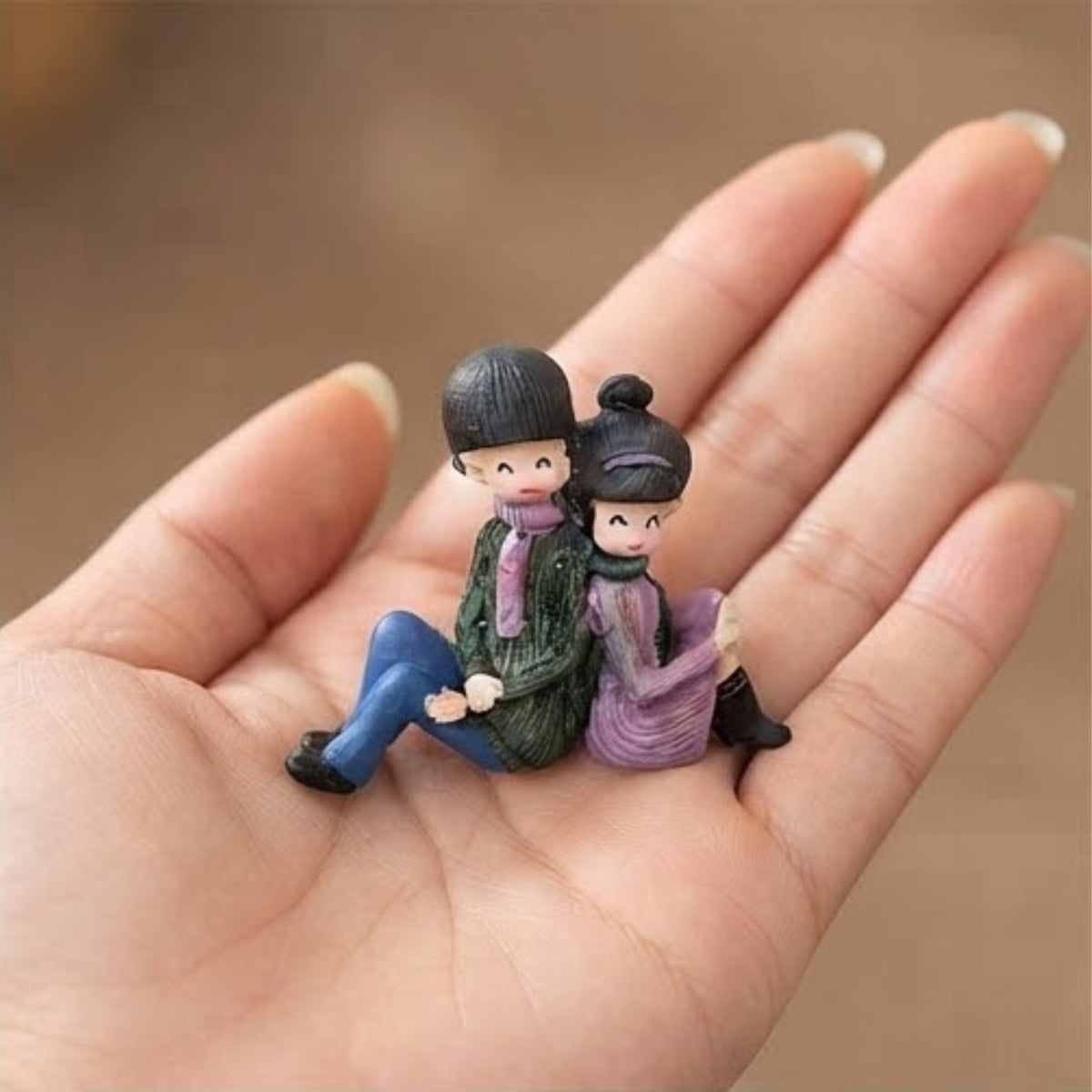 Couple Sitting Back to Back Miniature