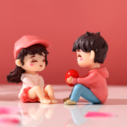 Couple Holding Heart Miniature