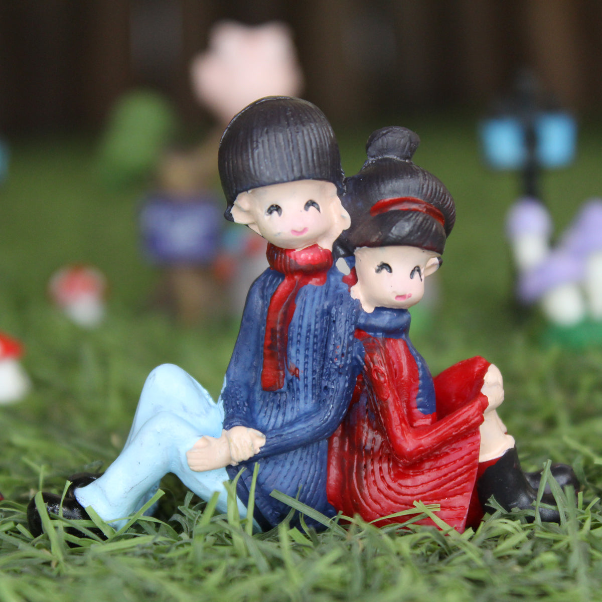Couple Sitting Back to Back Miniature